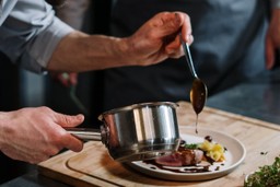 chef-preparing-delicious-food-sauce-menu-planning