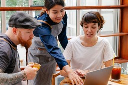 restaurant-owners-discussing-business-in-coffee-shop-cafe